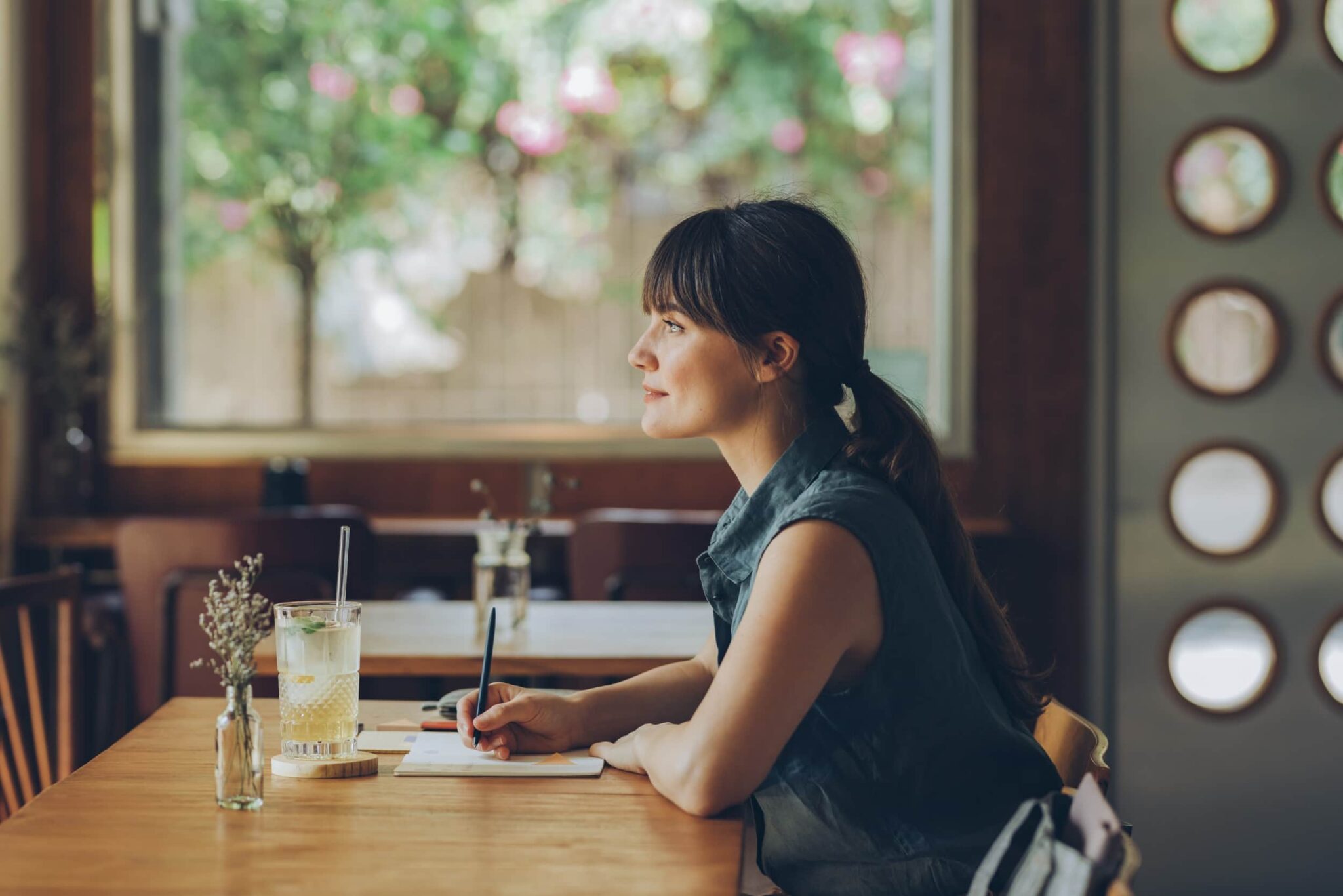 Smiling woman sitting at table